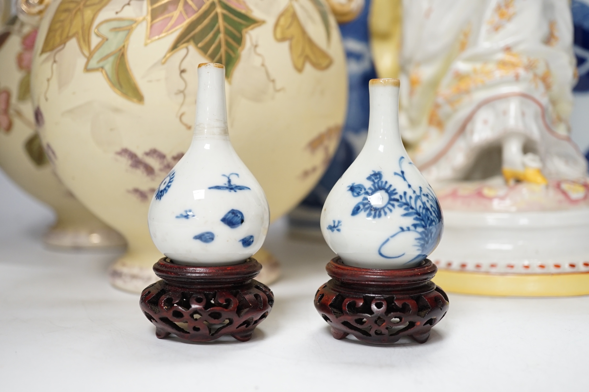 A late 19th century Continental figurine, two pairs of vases and a pair of Japanese miniature vases on stands, tallest 32cm high